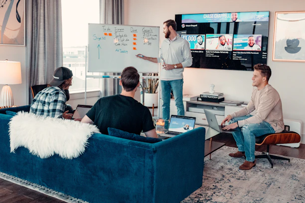 a group of people sitting around a living room