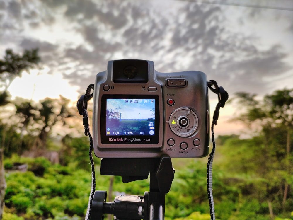 a digital camera with a sky background
