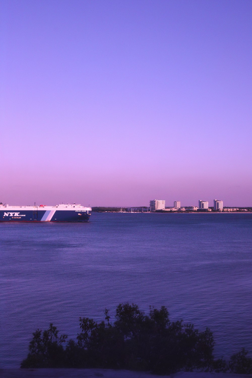 a large boat floating on top of a large body of water