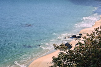 a view of a beach with a boat in the water