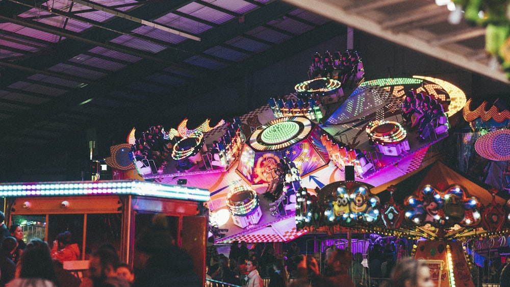 a carnival ride with lights and decorations on it