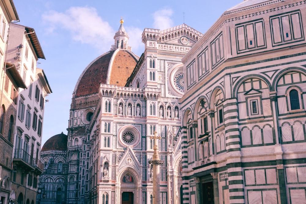 a large cathedral with a clock on it's side