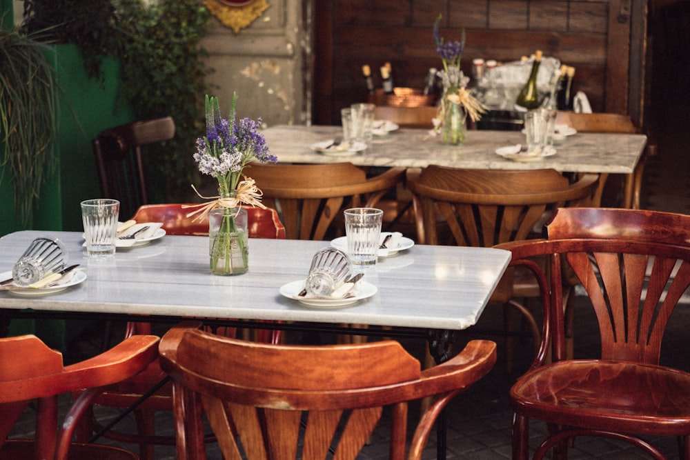 a table with a vase of flowers on top of it