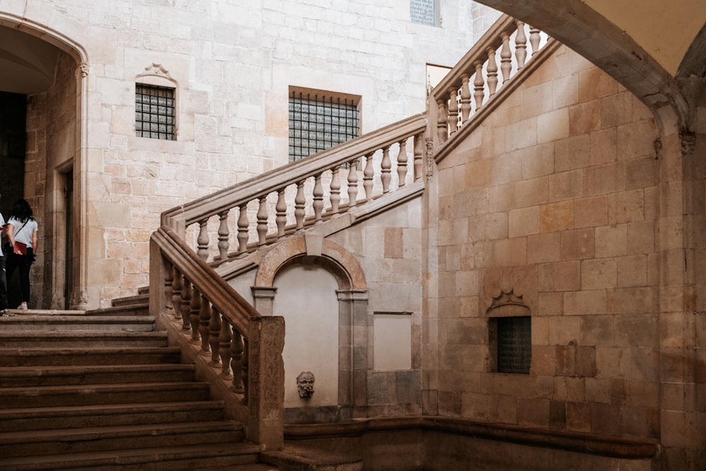 a couple of people that are standing on some stairs