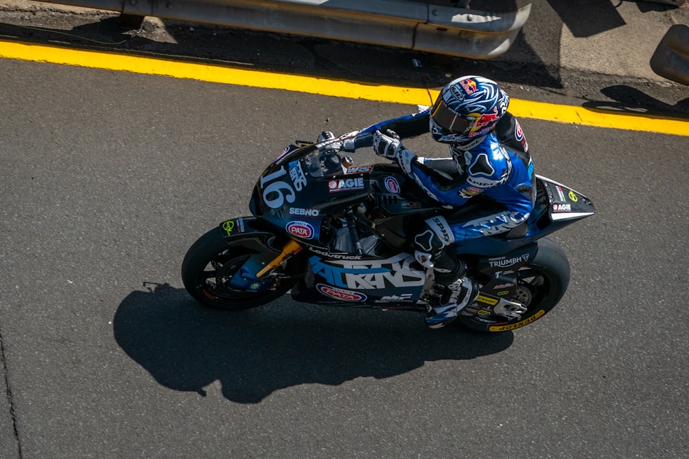 a person riding a motorcycle on a race track