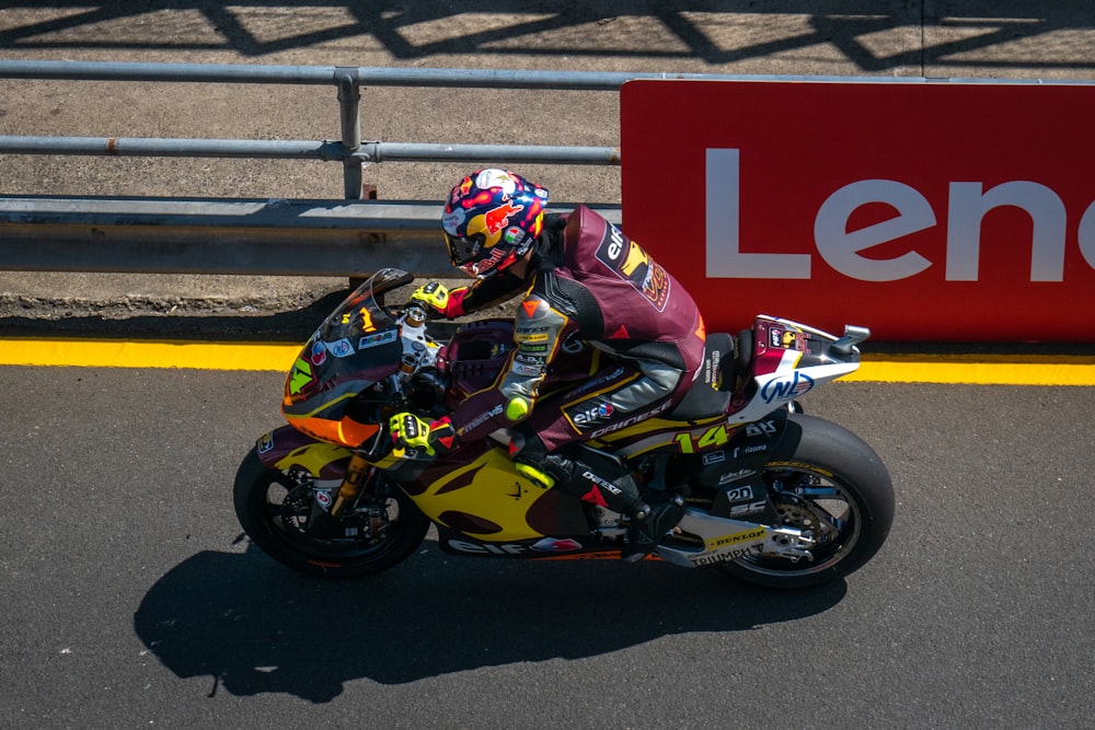 a person riding a motorcycle on a race track