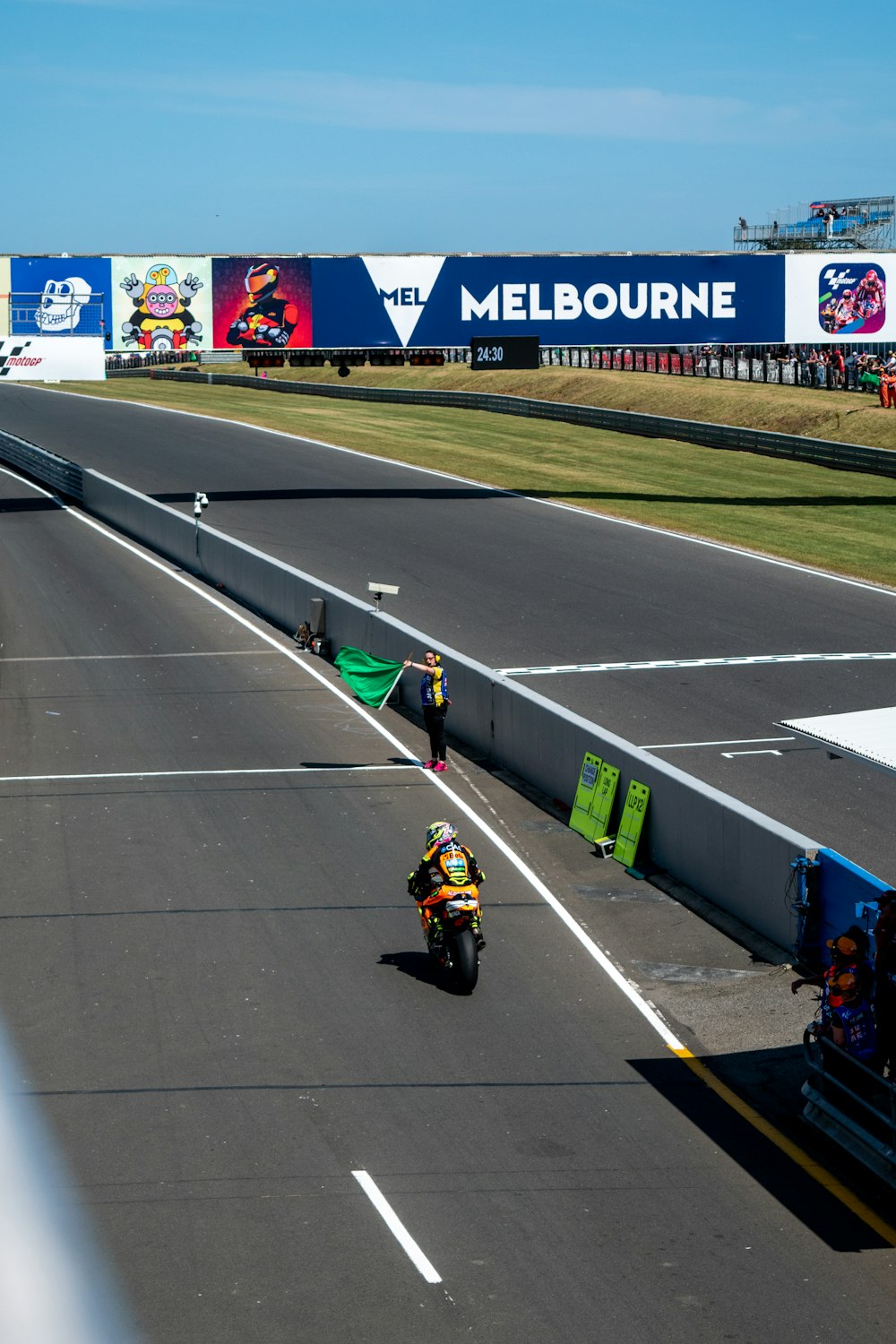 a person riding a motorcycle on a race track