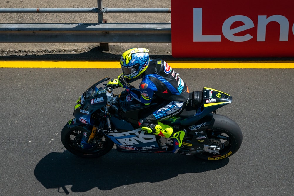 a person riding a motorcycle on a race track