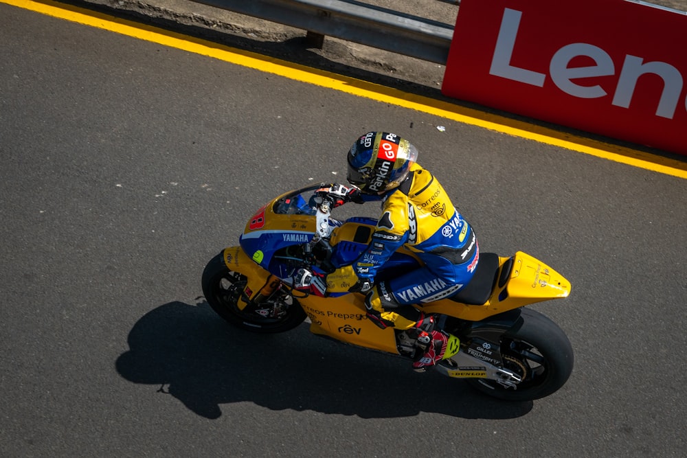 a person riding a motorcycle on a race track