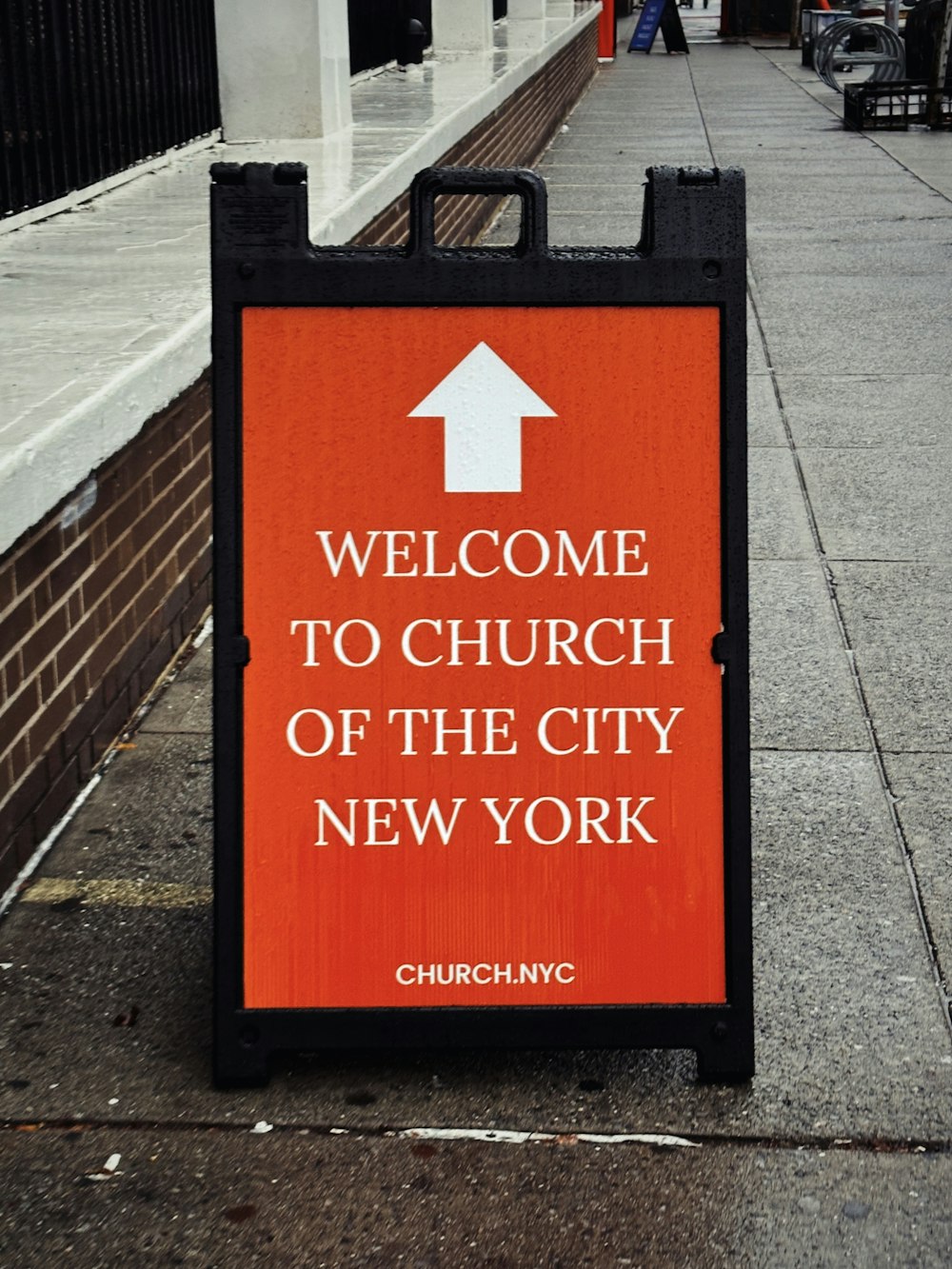 a sign on the side of the road that says welcome to church of the city