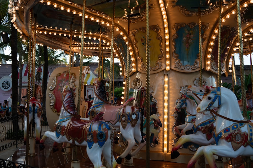 a merry go round at a carnival with lights