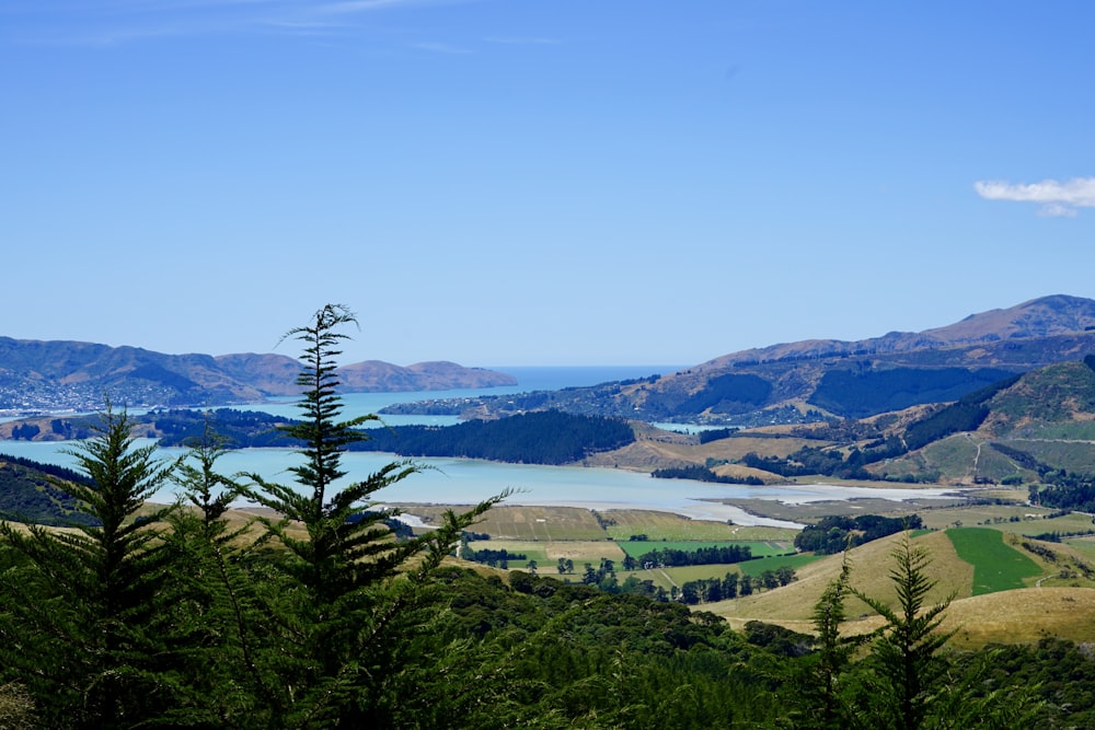 a scenic view of a lake and mountains