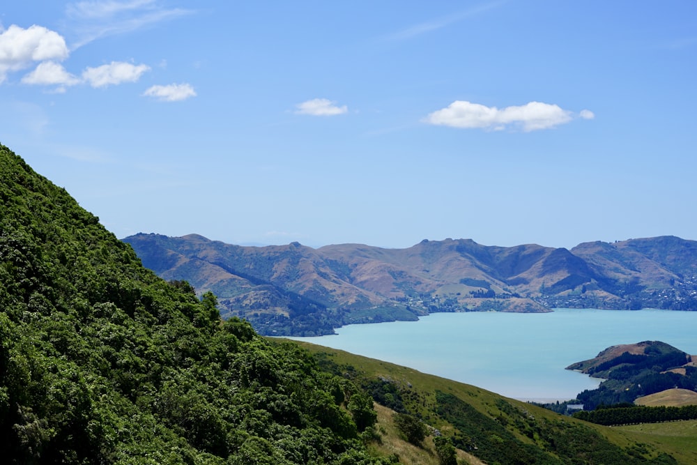 a scenic view of a lake and mountains