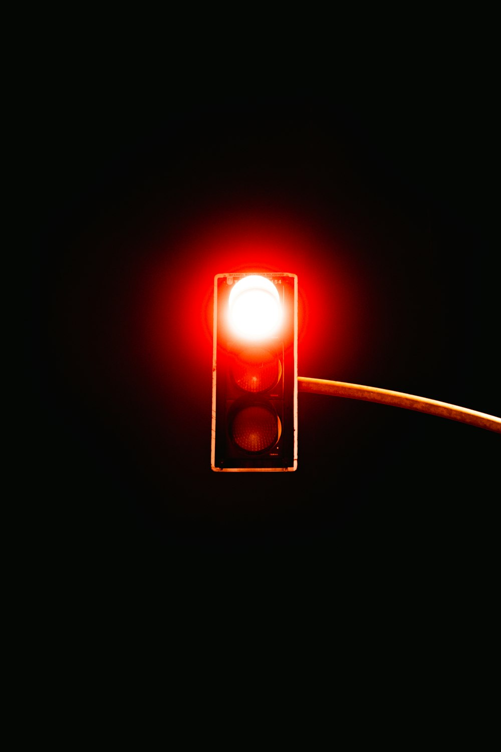 a traffic light with a red light attached to it