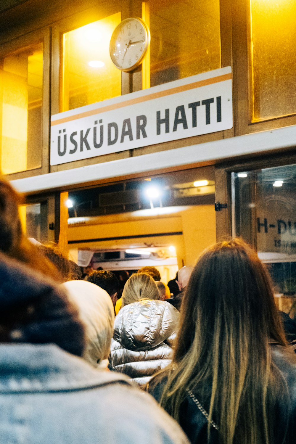 a group of people standing outside of a building