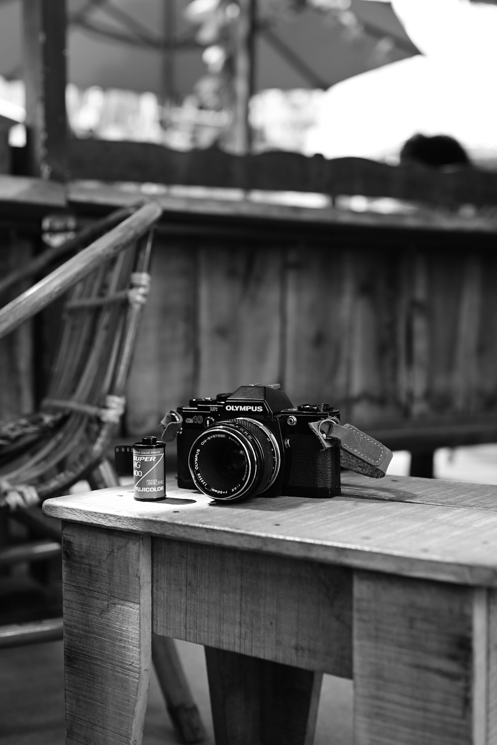 a camera sitting on top of a wooden table