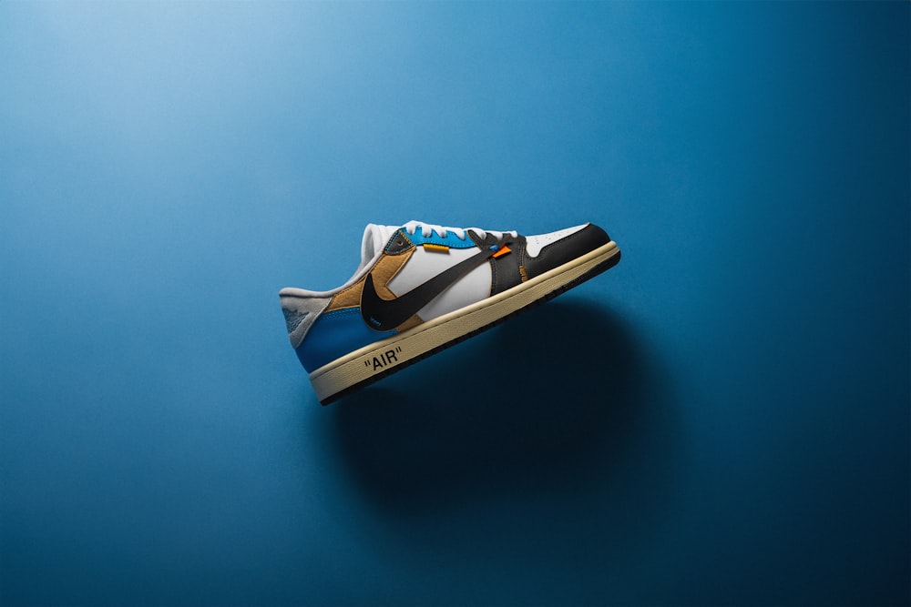 a pair of sneakers on a blue background