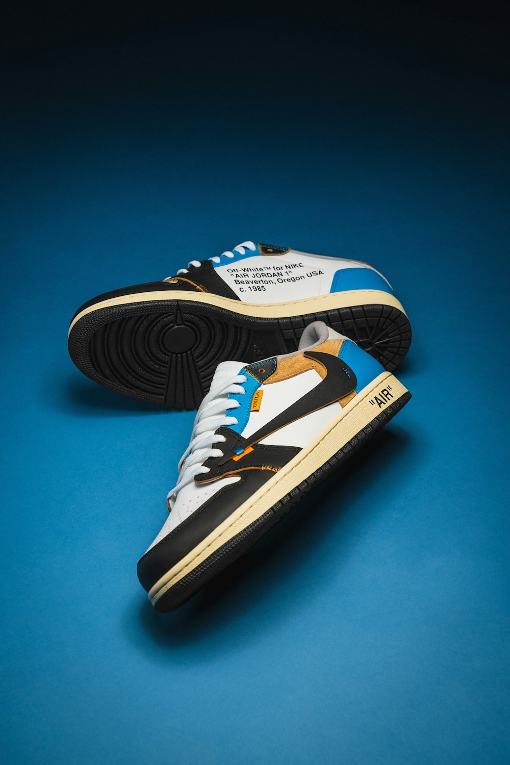 a pair of sneakers on a blue background