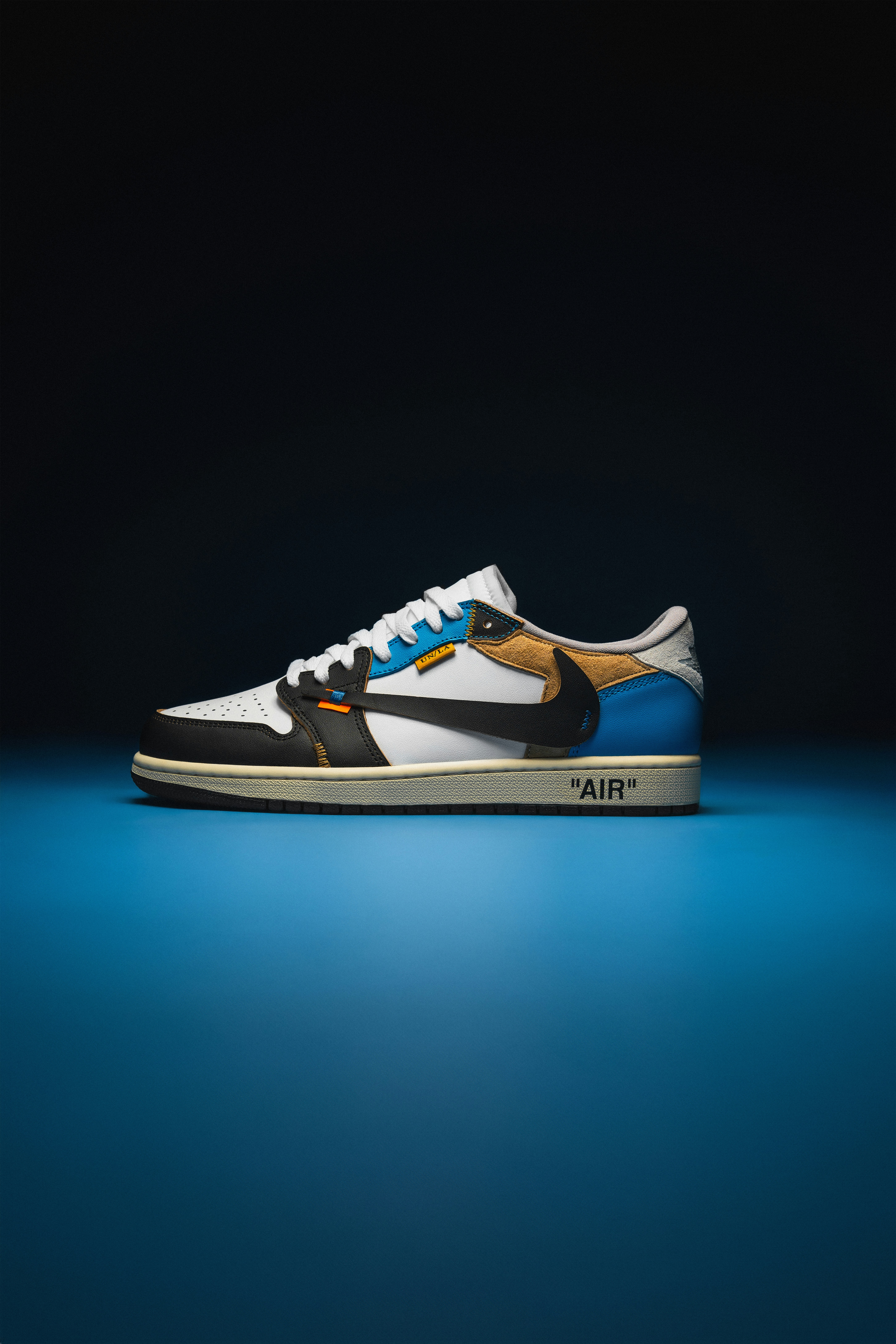 a white and blue sneaker with a black bottom