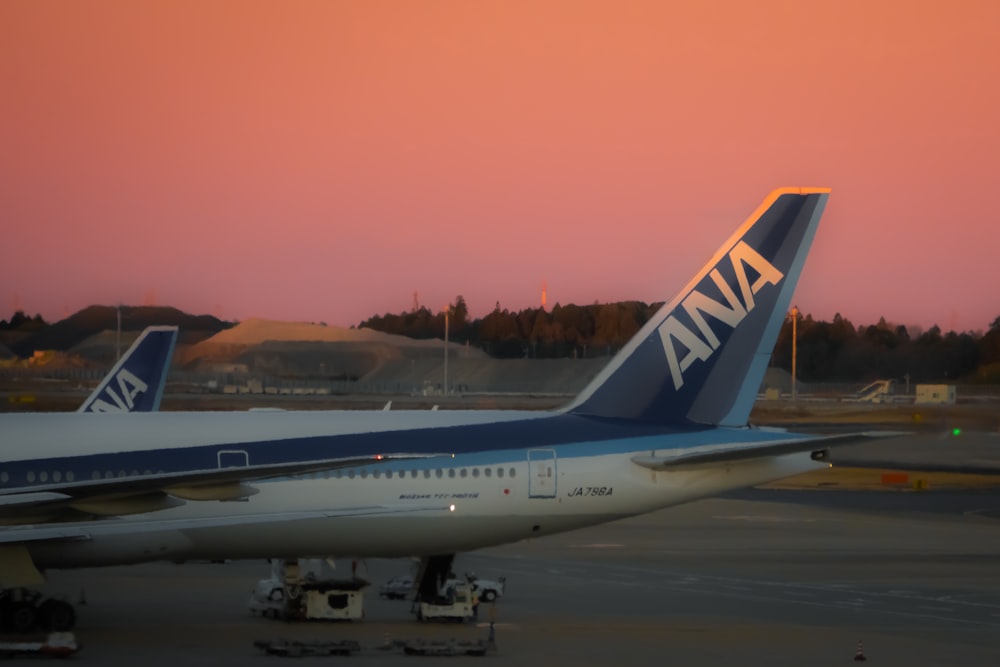 a large jetliner sitting on top of an airport tarmac