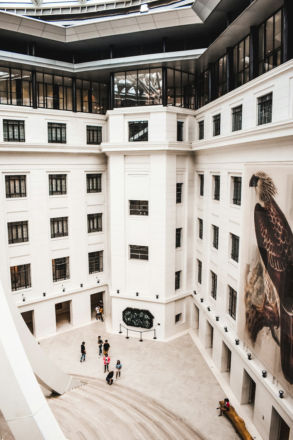 a group of people standing inside of a large building