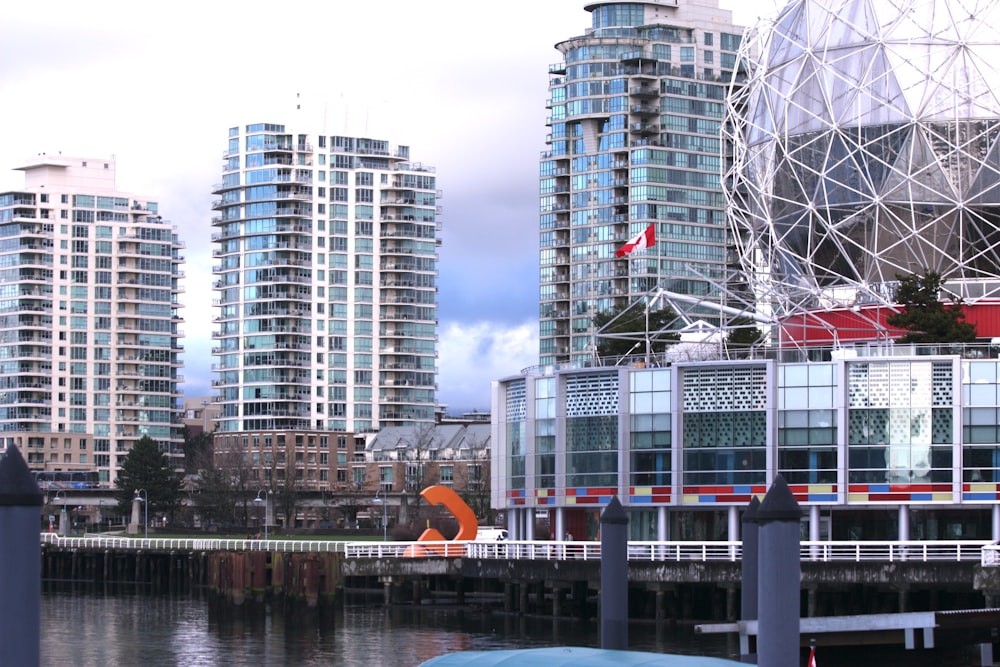 a body of water with buildings in the background