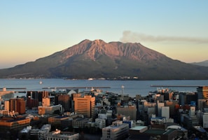 a view of a city with a mountain in the background