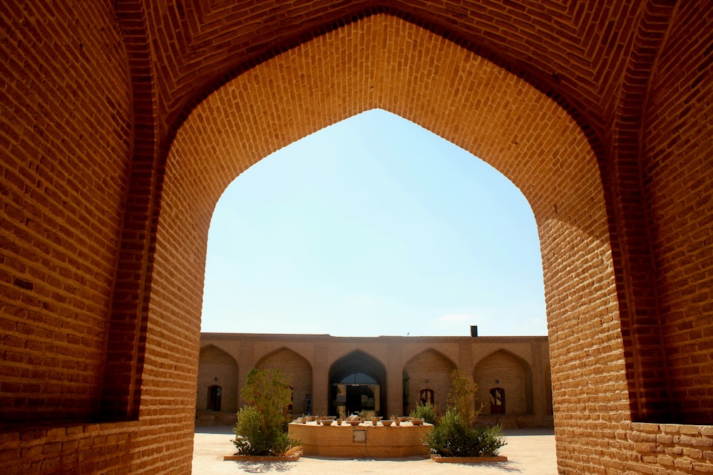 an archway with a table in the middle of it