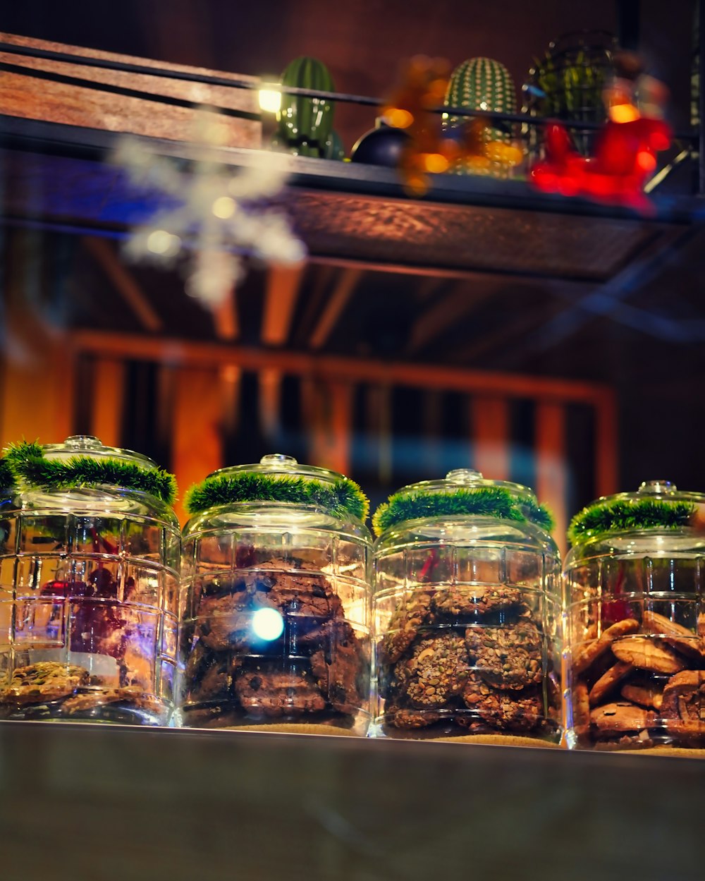 a row of glass jars filled with different types of food