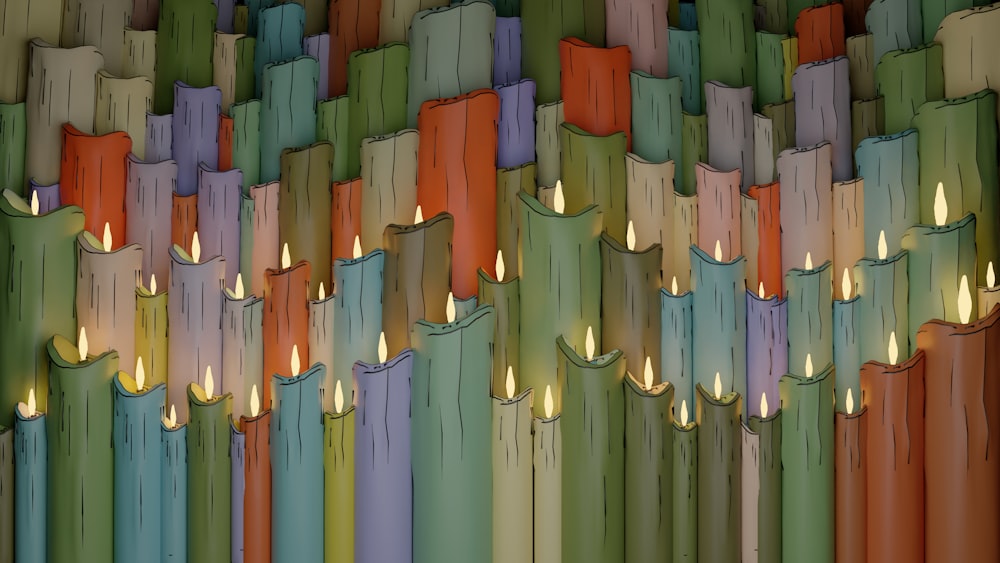 a multicolored wall with candles in the middle of it