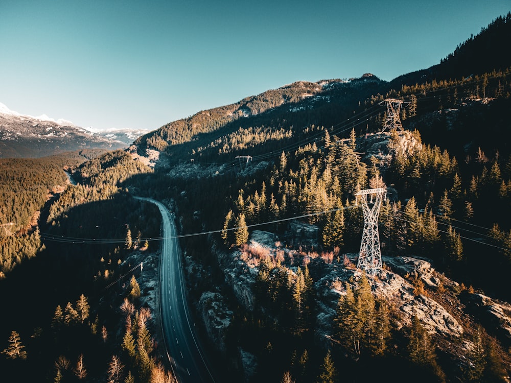 an aerial view of a road in the mountains