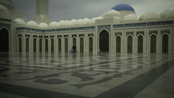 A large building with a blue dome on top of it — Turkistan, Kazakhstan