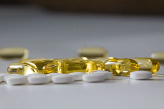 a close up of many pills on a table