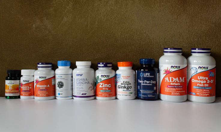 a row of bottles of different types of vitamins