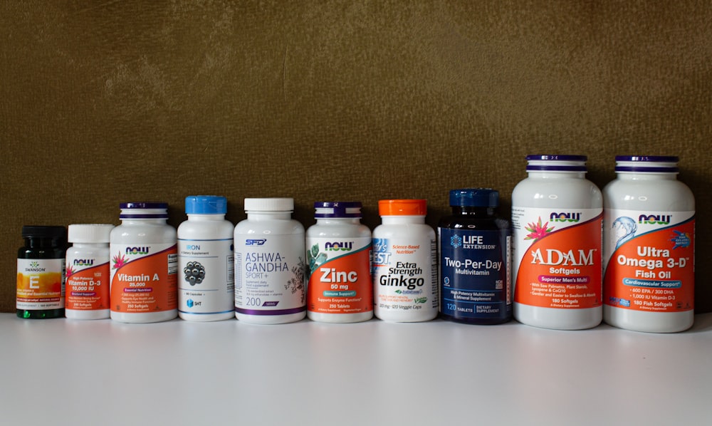 a row of bottles of different types of vitamins