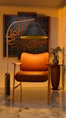 a chair and a lamp in a room