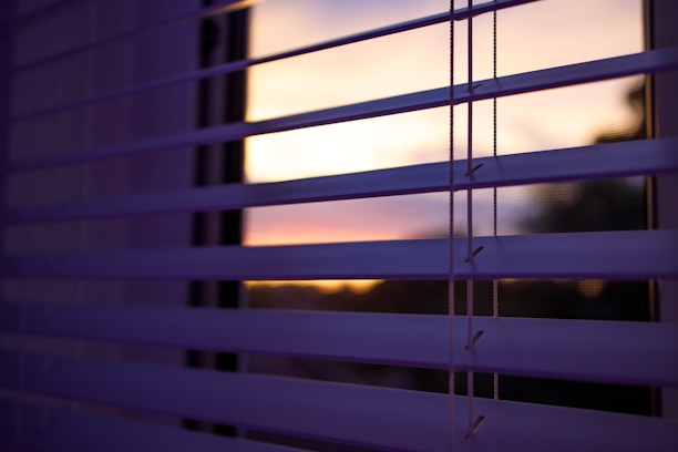 a close up of a window with the blinds closed