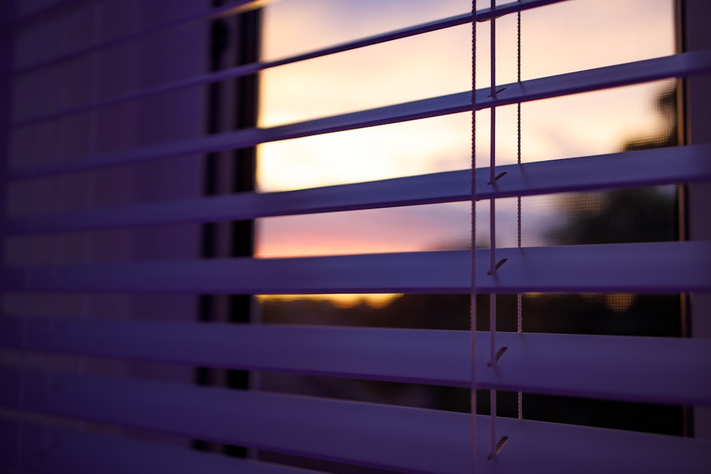 a close up of a window with the blinds closed