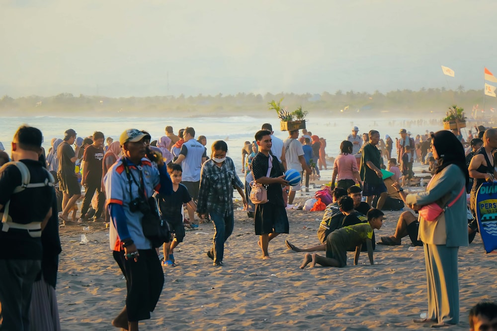 a large group of people on a beach