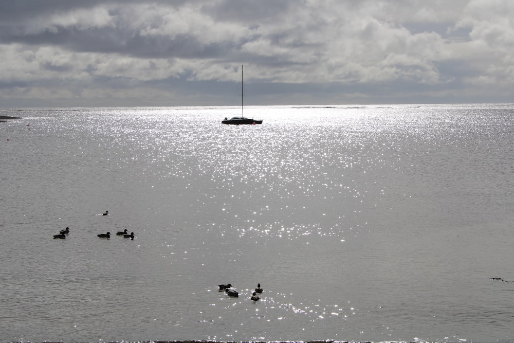 a boat floating on top of a large body of water