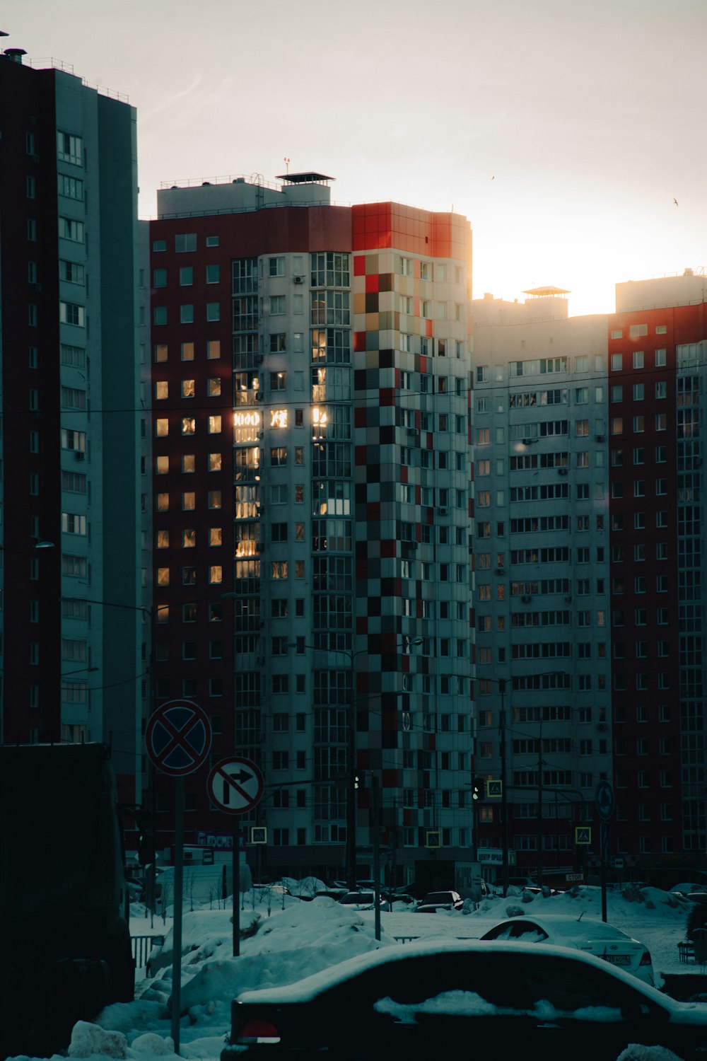 a city with tall buildings and snow on the ground