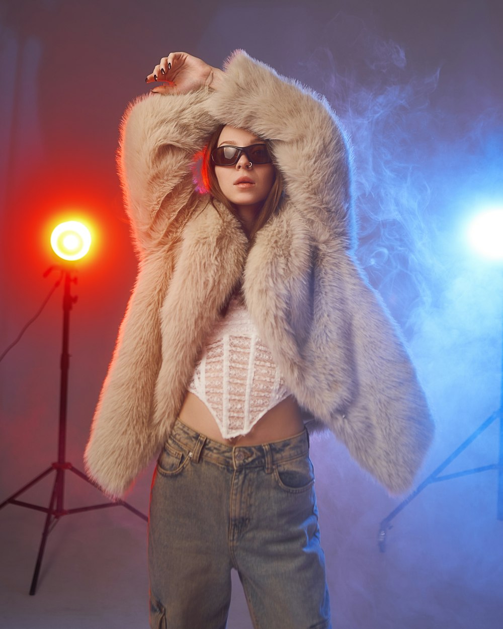 a woman in a fur coat posing for a picture