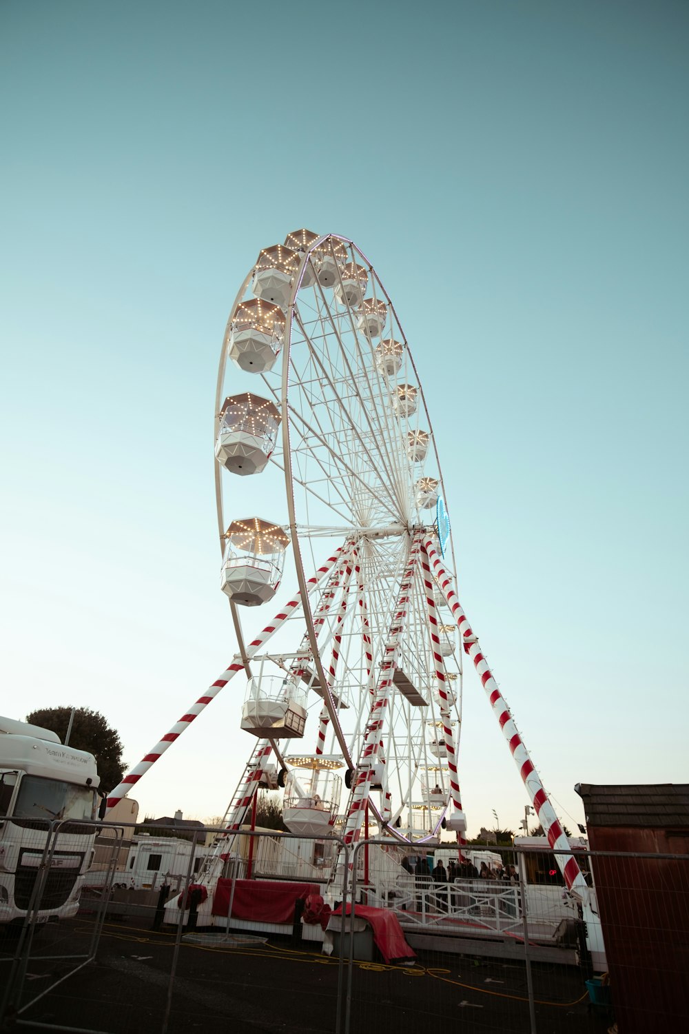 a large ferris wheel in a parking lot