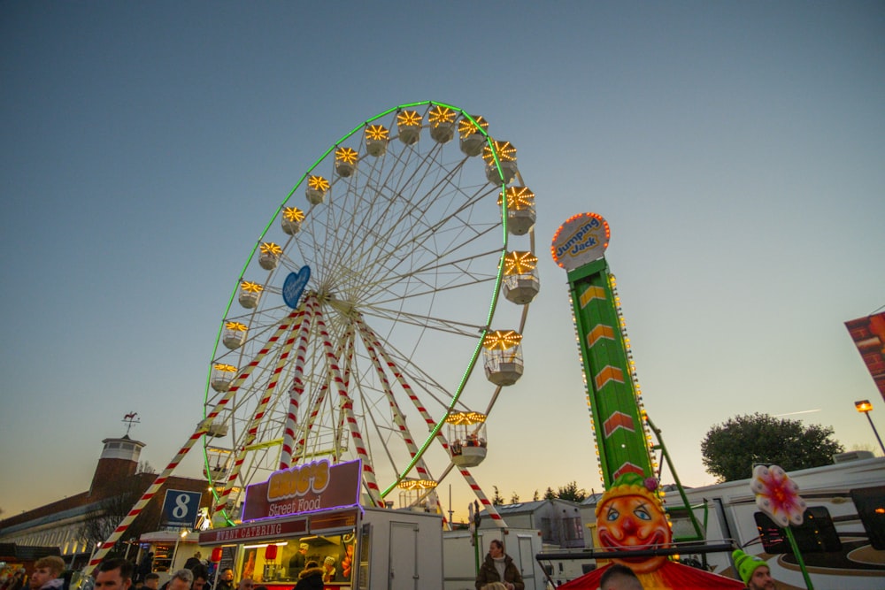 a ferris wheel and rides at a carnival