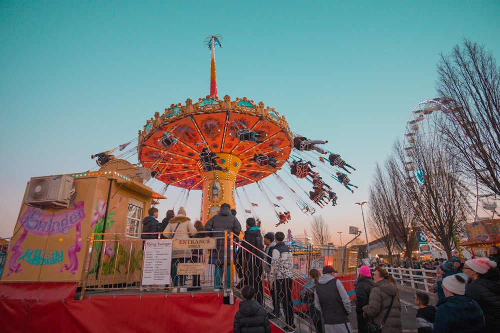 a carnival ride with people riding it