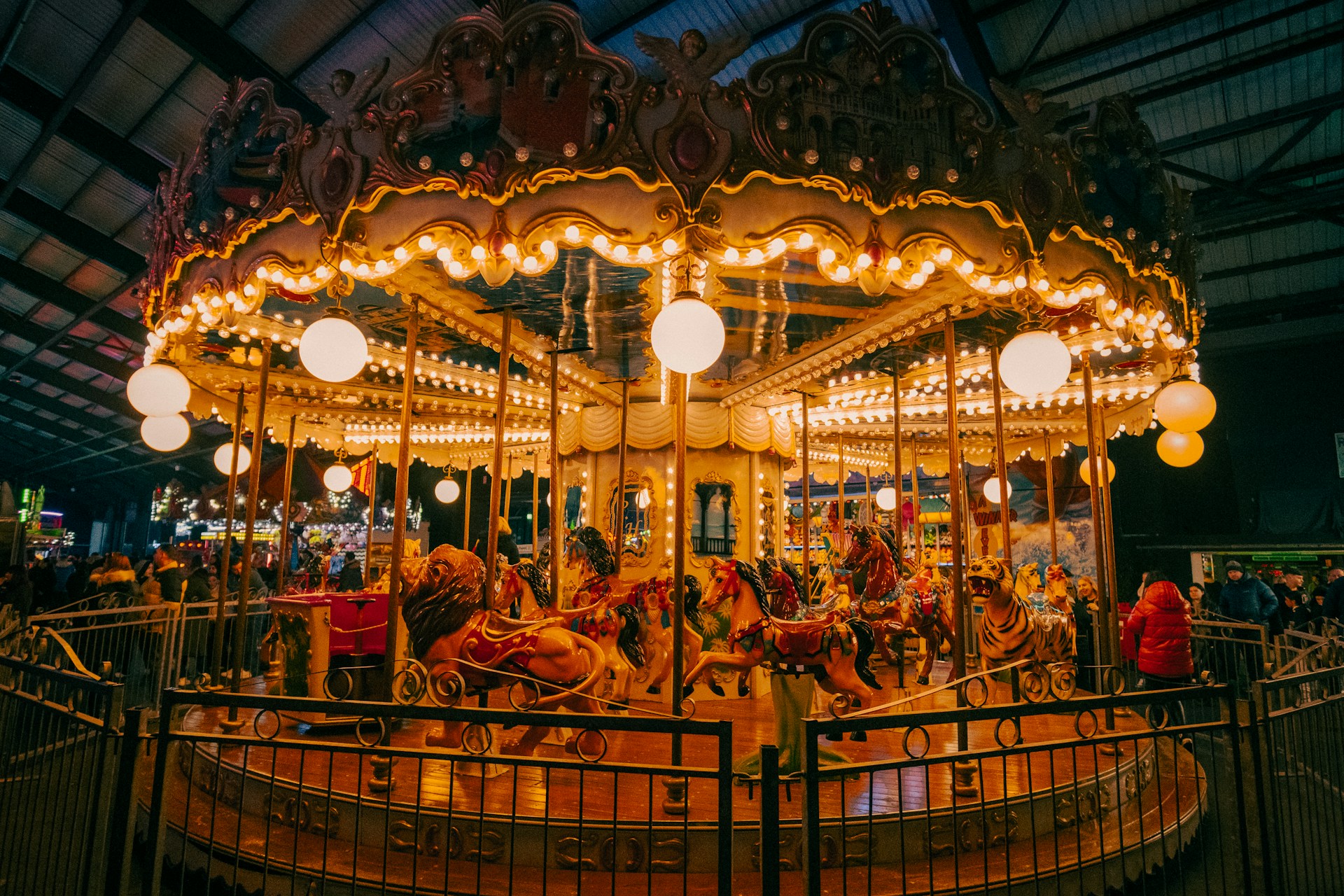 a merry go round in a building with lights