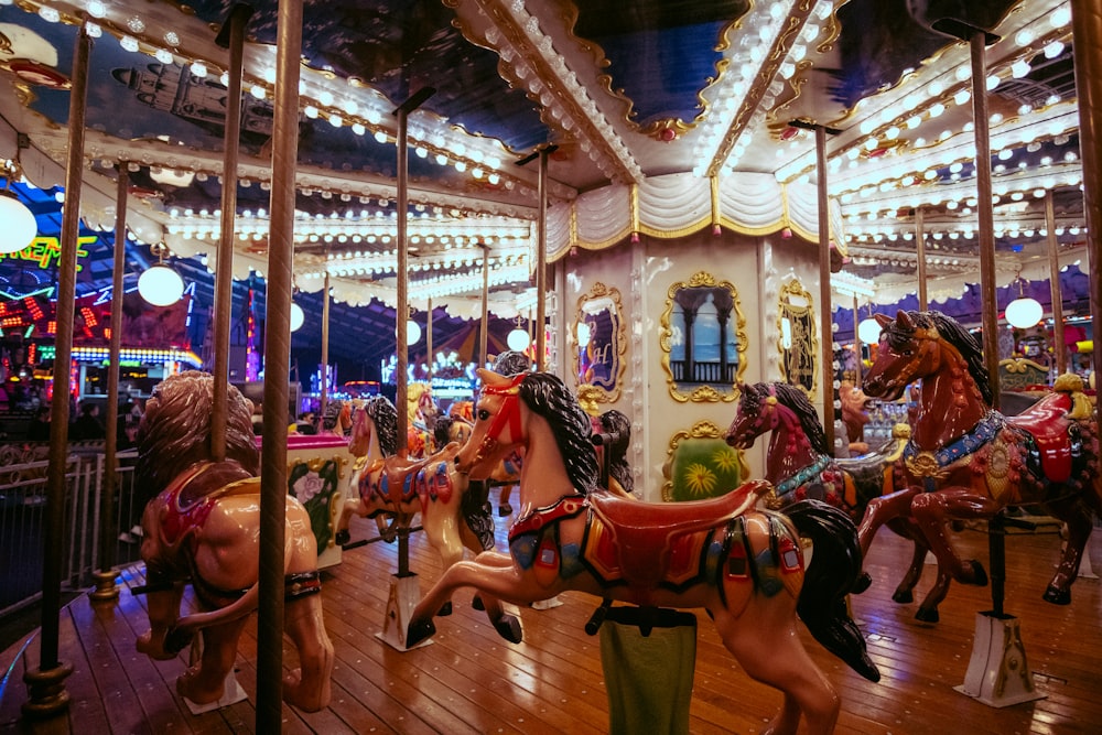 a merry go round with many horses on it