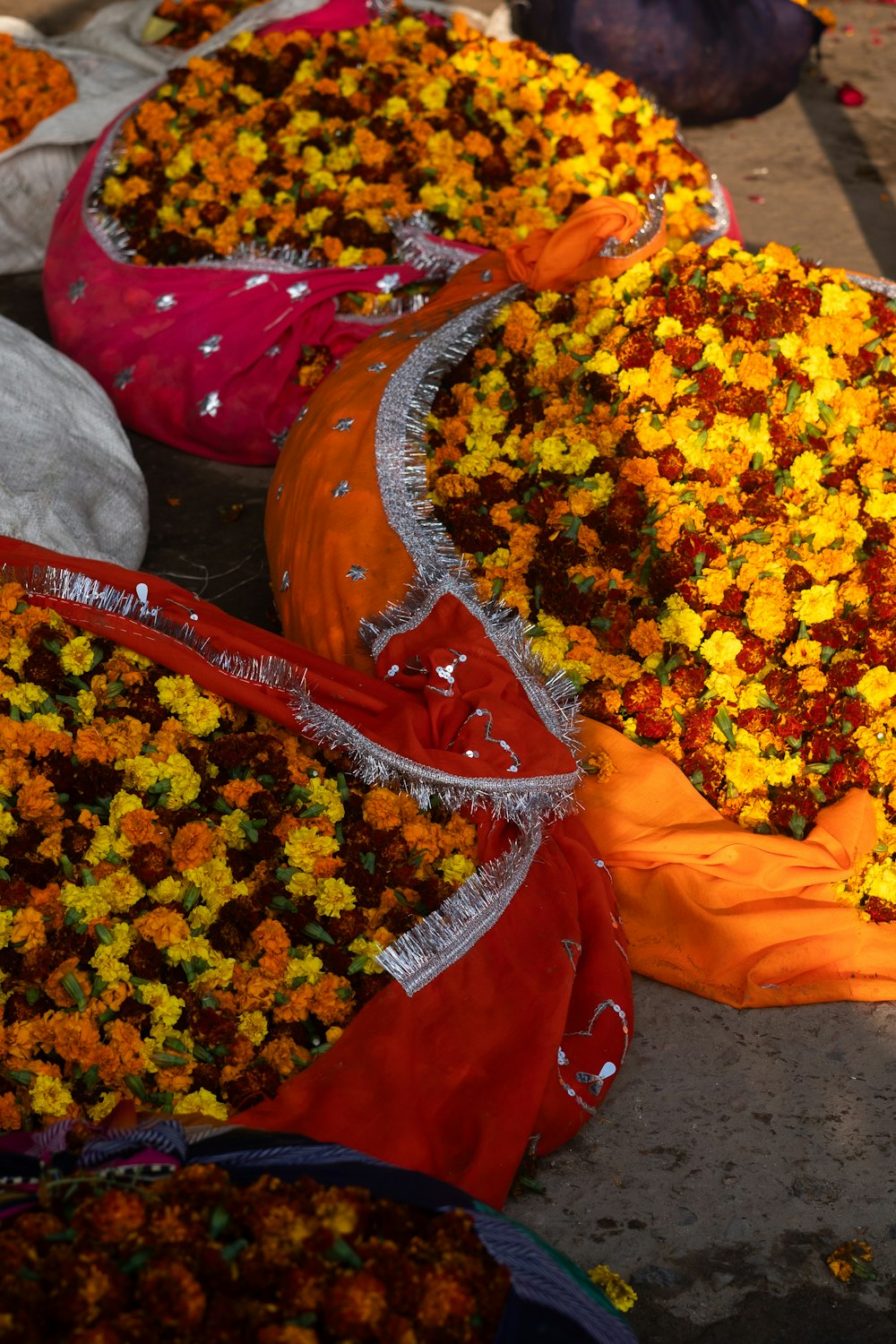 a bunch of bags filled with lots of flowers