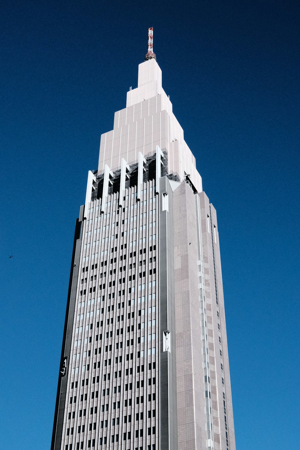 a tall building with a clock on the top of it