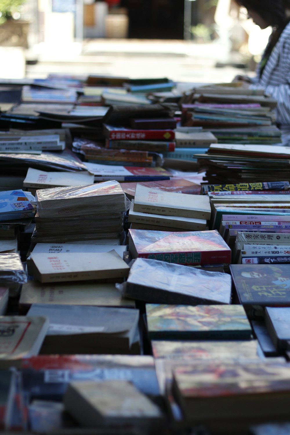 a large amount of books on the ground